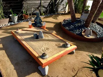 a wooden table with birds sitting on top of it at Kaza Kokos in Oceanside