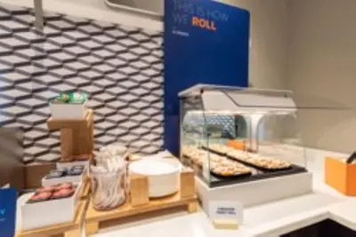 a bakery with a display of donuts on a counter at Holiday Inn Express La Mesa Near SDSU by IHG in La Mesa