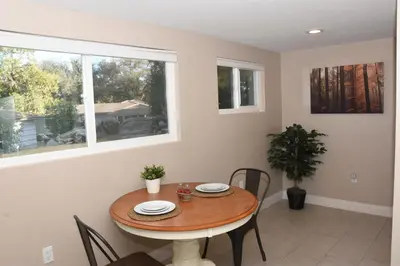 a dining room with a table and chairs and a window at Apple Tree Inn in Julian