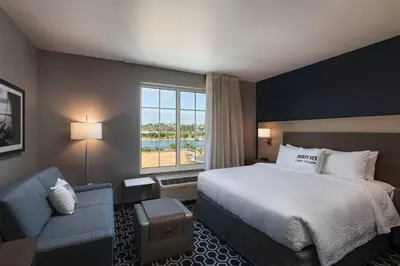 a hotel room with a bed and a window at TownePlace Suites by Marriott San Diego Airport/Liberty Station in San Diego