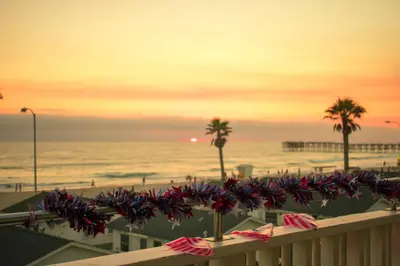 a view of the beach and the ocean at sunset at The Beach Cottages in San Diego