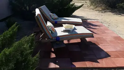 a wooden bench sitting on a brick patio at Kokopelli's Hideaway in Julian