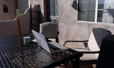 a laptop computer sitting on top of a table at Kokopelli's Hideaway in Julian