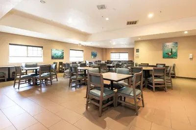 a large dining room with tables and chairs at Best Western Inn & Suites San Diego Zoo -SeaWorld Area in San Diego