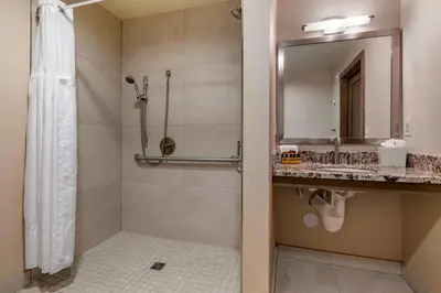 a bathroom with a shower and a sink at Best Western PLUS Island Palms Hotel & Marina in San Diego