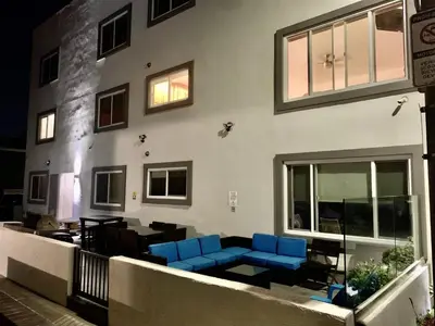 a room with blue chairs and a building at 101-Luxury1 in San Diego