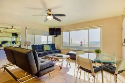 a living room with a couch and a table at 102-Luxury2 in San Diego