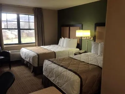 a hotel room with two beds and a window at Extended Stay America Suites - Orange County - Lake Forest in Foothill Ranch