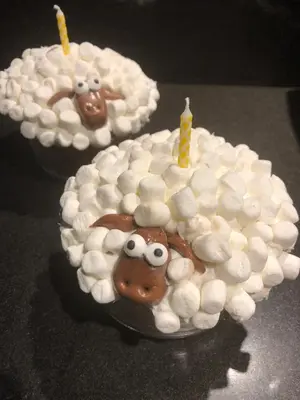 a cake with a sheep with two candles on it at Wine Country Private Working Sheep Farm; Rustic Elegance in Temecula