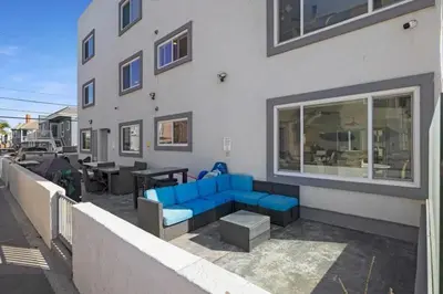 a blue couch sitting outside of a building at 108-Ocean Front Combo in San Diego