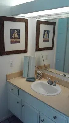 a bathroom with a sink and a mirror at 25 Steps to the Beach in Newport Beach