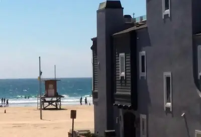 a view of the beach from a building at 25 Steps to the Beach in Newport Beach