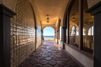 an empty hallway with a view of the ocean at La Jolla Shores Hotel in San Diego