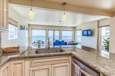 a kitchen with a sink and a view of the ocean at Ocean Beach Cliffs Sanctuary Oceanfront in San Diego