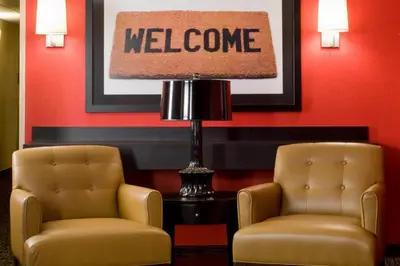 two chairs and a lamp in a waiting room at Extended Stay America Suites - San Diego - Mission Valley - Stadium in San Diego