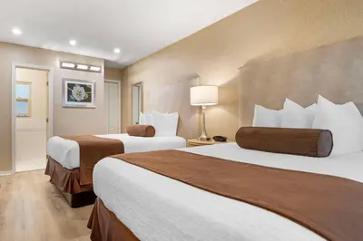 a hotel room with two beds and a lamp at Best Western Downtown San Diego in San Diego