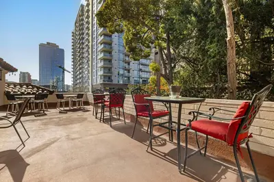 a patio with chairs and a table on a balcony at Best Western Downtown San Diego in San Diego