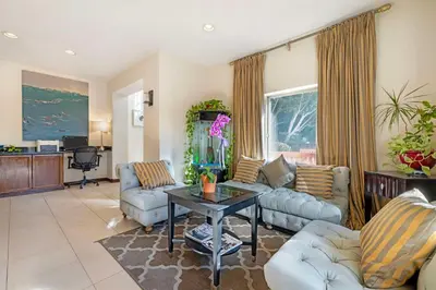 a living room with couches and a table at Best Western Downtown San Diego in San Diego
