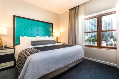 a hotel room with a bed and a large window at WorldMark San Diego - Balboa Park in San Diego