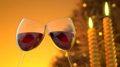 two glasses of red wine next to a christmas tree at Holiday Inn Express & Suites - Murrieta by IHG in Murrieta