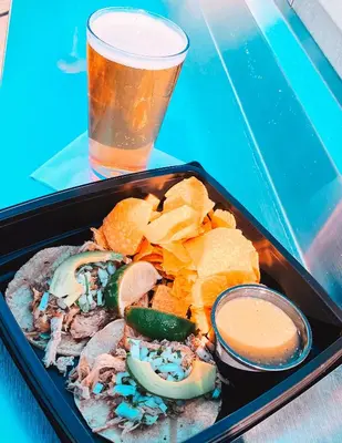 a tray of food with chips and a drink at San Diego Marriott Gaslamp Quarter in San Diego