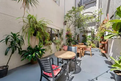 a patio with a table and chairs and plants at Comfort Inn Gaslamp Convention Center in San Diego