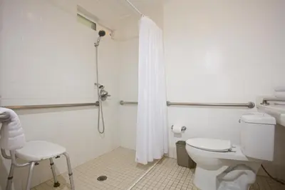 a bathroom with a toilet and a shower at Ocean Beach Hotel in San Diego