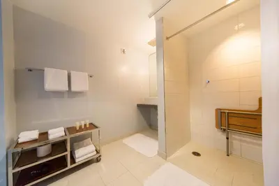 a bathroom with a walk in shower and a sink at Tower 23 Hotel in San Diego