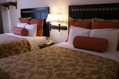 a hotel room with two beds and a phone at Harborview Inn & Suites-Convention Center-Airport-Gaslamp-Seaworld-Zoo-Balboa Park in San Diego