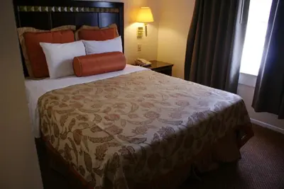a bedroom with a large bed in a hotel room at Harborview Inn & Suites-Convention Center-Airport-Gaslamp-Seaworld-Zoo-Balboa Park in San Diego