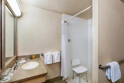 a bathroom with a sink and a shower at Handlery Hotel San Diego in San Diego