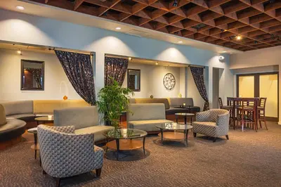 a waiting room with couches and chairs and tables at Handlery Hotel San Diego in San Diego