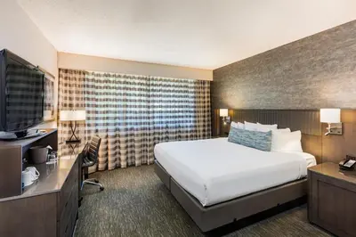 a hotel room with a bed and a television at Handlery Hotel San Diego in San Diego