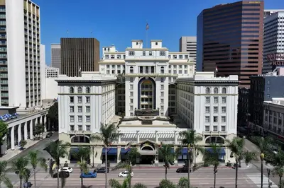 a large white building in the middle of a city at The US Grant, a Luxury Collection Hotel, San Diego in San Diego