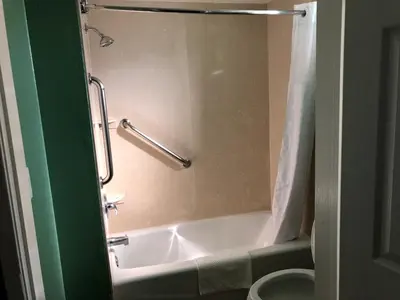 a bathroom with a bath tub and a toilet at Quality Inn Hemet - San Jacinto in Hemet