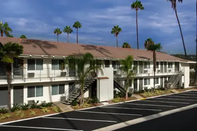 a parking lot in front of a hotel at Hotel Iris - Mission Valley-San Diego Zoo-SeaWorld in San Diego