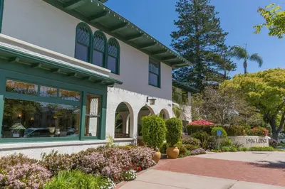 a store front with flowers in front of a building at 1906 Lodge in San Diego