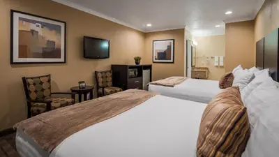 a hotel room with two beds and a television at Best Western Poway/San Diego Hotel in Poway
