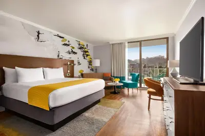 a hotel room with a bed and a television at Town and Country San Diego in San Diego