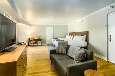 a hotel room with a bed and a couch at Town and Country San Diego in San Diego