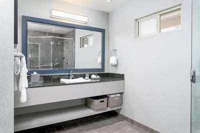 a bathroom with a sink and a mirror at Beach Terrace in Carlsbad