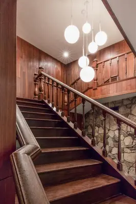 a staircase in a house with wooden walls and lights at Kings Inn in San Diego