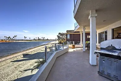a house with a view of the beach at Beachfront San Diego Condo with Patio on the Bay! in San Diego
