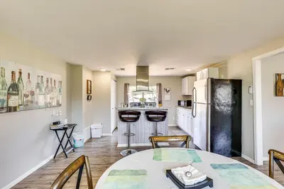 a kitchen with a table and chairs and a refrigerator at Escondido Vineyard Estate Walk to Wineries! in Escondido