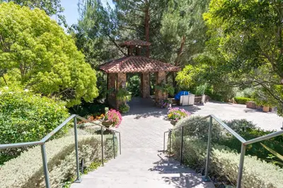 a garden with a gazebo and a walkway at Pala Mesa Resort in Fallbrook