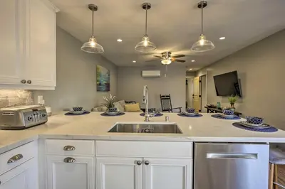 a kitchen with a sink and a microwave at San Diego Home - Walk to Sail Bay and Mission Beach! in San Diego