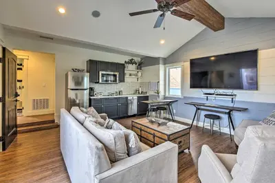 a living room with two couches and a kitchen at San Diego Home - Walk to Sail Bay and Mission Beach! in San Diego