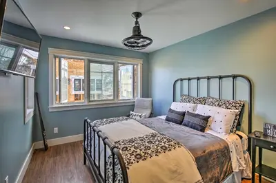 a bedroom with a bed in a room with blue walls at San Diego Home - Walk to Sail Bay and Mission Beach! in San Diego