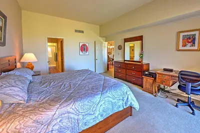 a bedroom with a bed and a desk and a chair at Borrego Springs Condo with Private Patio and Views! in Borrego Springs