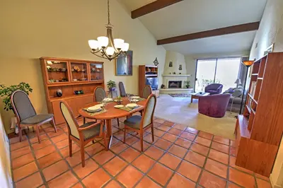 a dining room and living room with a table and chairs at Borrego Springs Condo with Private Patio and Views! in Borrego Springs